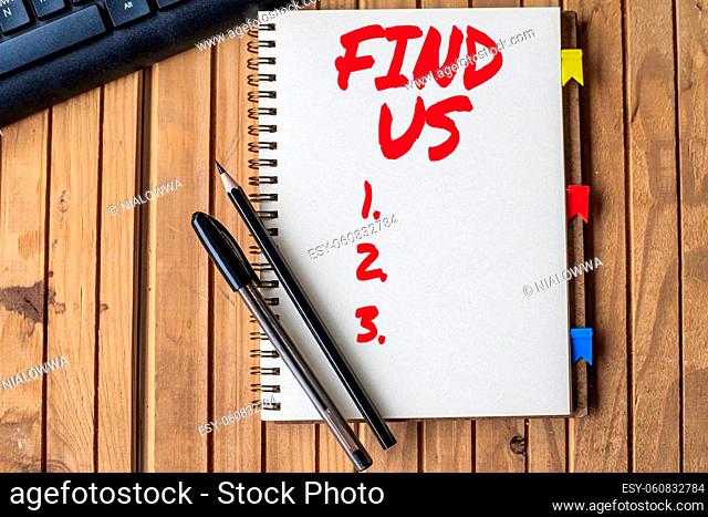 Handwriting text Find Us, Word Written on individuals private or personal information by another person Empty Open Clipped Journal Beside Keyboard Pens On Top...
