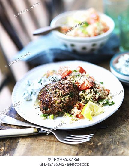 A meatball with couscous and tzatziki