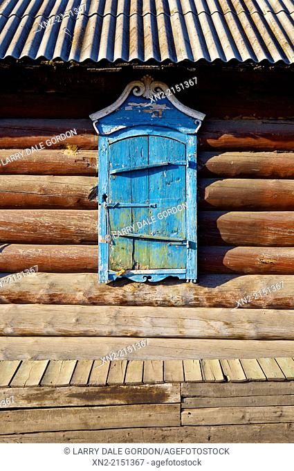 Close-up of a window shade on a traditional log house in the 'Old Believers' Village', settled by members of a 'heretical' offshoot of the Russian Orthodox...