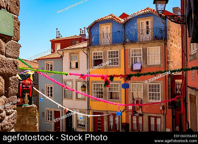 Porto, Portugal - Small Cobblestone Square with Traditional Colorful Houses with Popular Saints Decorations