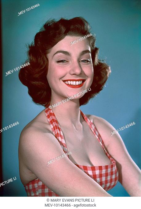 An engaging young brunette model with a broad, bright smile wears a halter-neck gingham sun-top