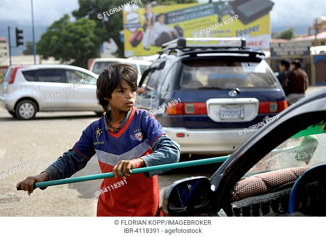Street child cleaning windshield, Cochabamba, Bolivia