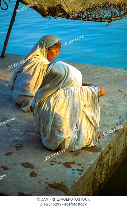 praying women at Ganga riverbank at Varanasi, india
