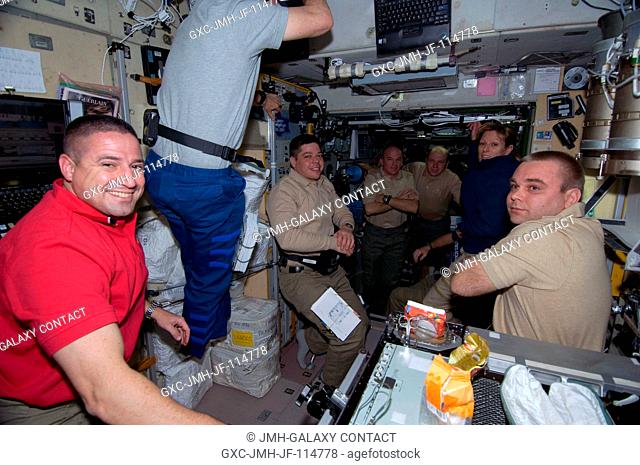 STS-130 and Expedition 22 crew members are pictured shortly after space shuttle Endeavour and the International Space Station docked in space and the hatches...