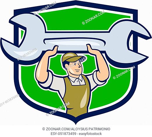Illustration of a mechanic wearing hat and overalls looking to the side lifting giant spanner wrench viewed from front set inside shield crest on isolated...
