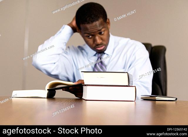 View of business man with books in an office