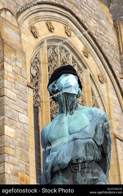 Detroit, Michigan - A statue outside the Metropolitan United Methodist Church wears a face mask during the Covid-19 pandemic