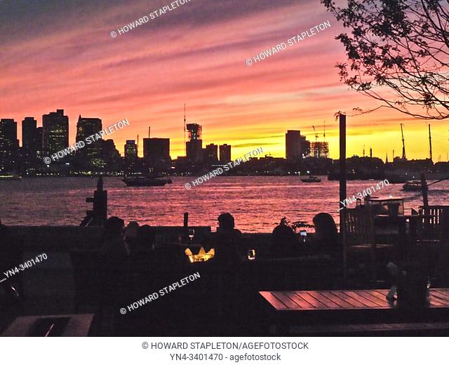 Sunset over Boston harbor and Boston, Massachusetts