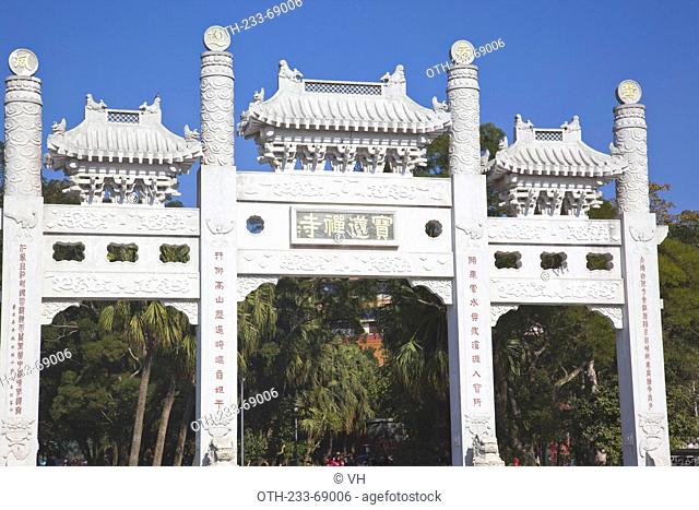 White gateway on the approach to the Po Lin Monastery, Lantau Island, Hong Kong