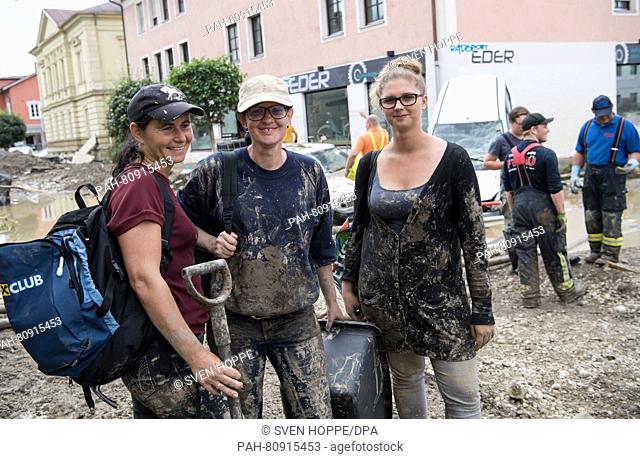 Helpers Edith Schreiber (L-R), Nadja Knauseder and Lydia Rachbauer from Braunau, Austria, pose in the city centre of Simbach am Inn, Germany, 03 June 2016