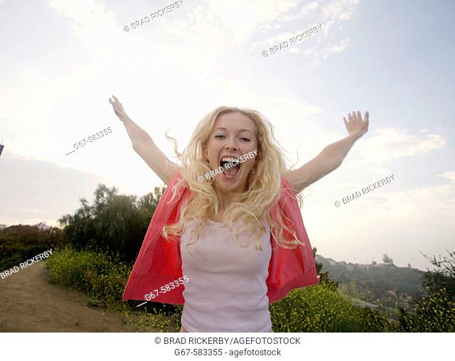 Happy girl screams out her joy, Los Angeles, CA, USA