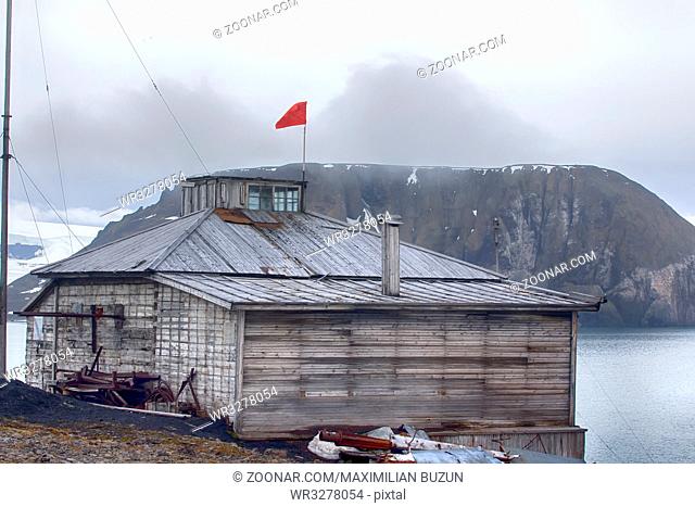 Severe land. One of the oldest polar stations in Arctic (founded in 1928, now abandoned). Wooden houses have been preserved well