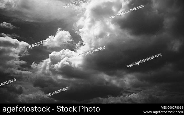 Black And White. Cloudy Sky With Dark Clouds Before Rain. Natural Background With Rainclouds. Time Lapse, Timelapse, Time-lapse