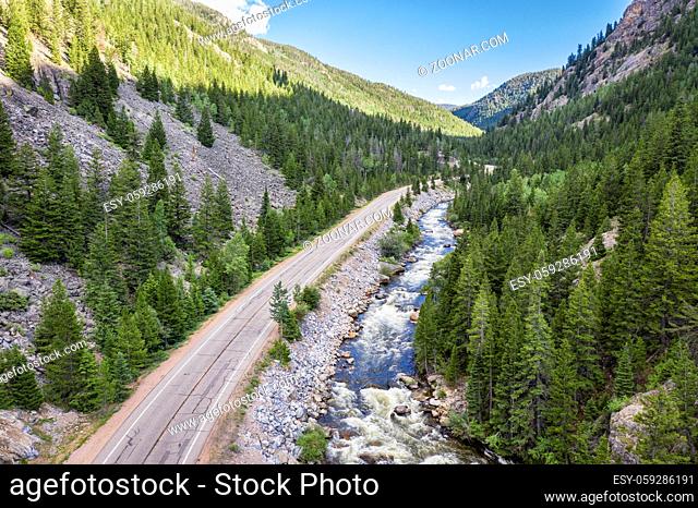 Cache la Poudre River and highway at Poudre Falls - aerial view in summer with high flow
