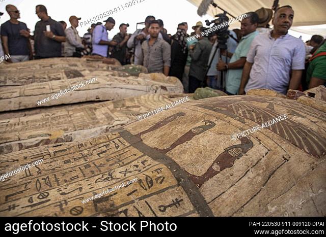 30 May 2022, Egypt, Saqqara: Media personnel an experts attend a media opportunity during which a new archaeological discovery of artefacts dating back to the...