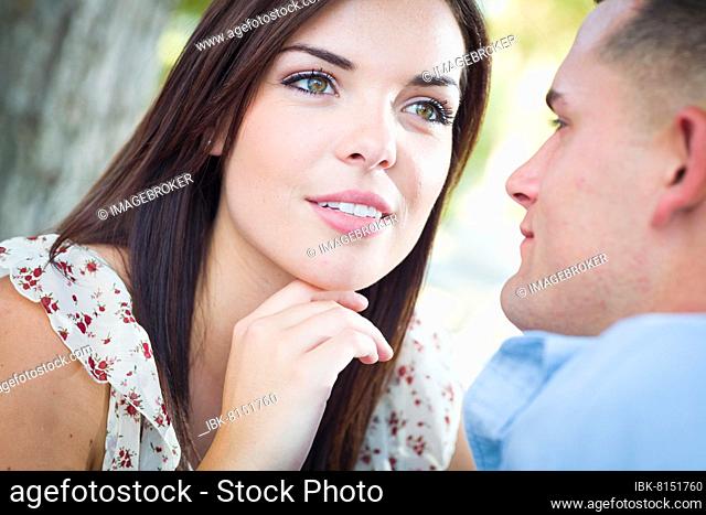 Happy romantic caucasian couple portrait in the park