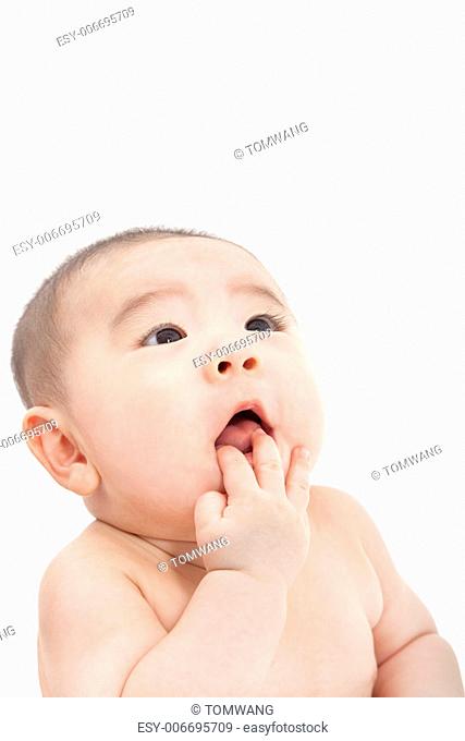asian baby looking something and thinking
