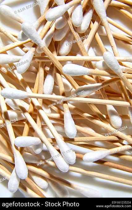 Flat lay Eco-friendly cotton swabs, bamboo cotton buds, Wooden sticks for cleaning ears on white background, copy space