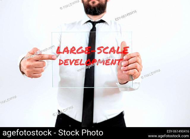 Hand writing sign Large Scale Development, Word for Develop on an extensive basis grow up a lot