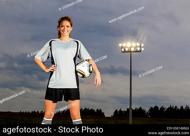 Female soccer player working out on a soccer field