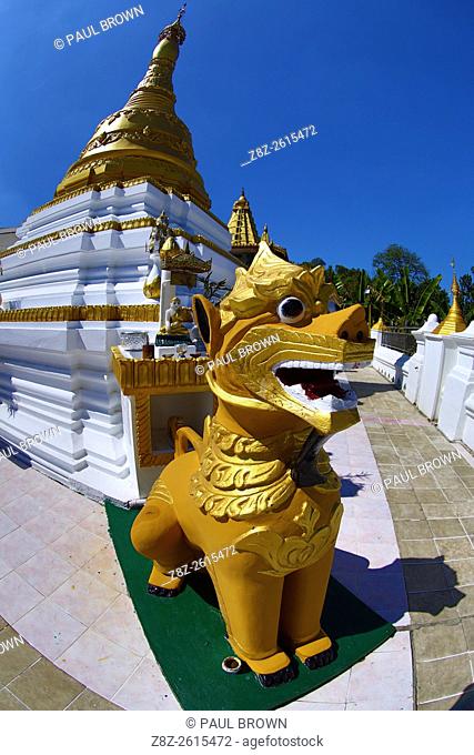 Gold stupa and lion statue at Nga Htat Gyi Pagoda, Yangon, Myanmar