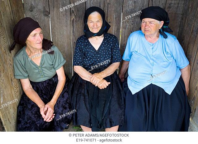 Three elderly women in village, Budesti, Maramures, Romania