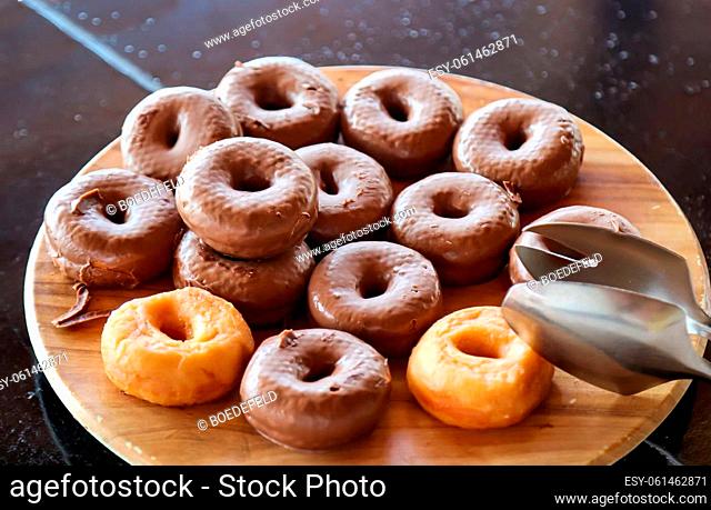 Chocolate covered donuts on a plate