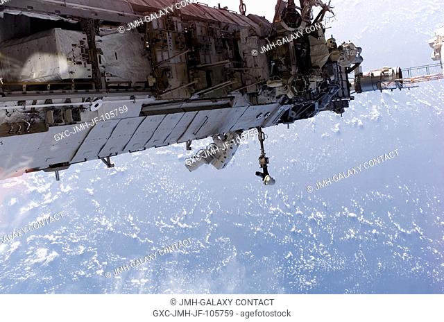 In the center of this panoramic scene of new hardware on the International Space Station, astronaut Heidemarie M. Stefanyshyn-Piper, mission specialist