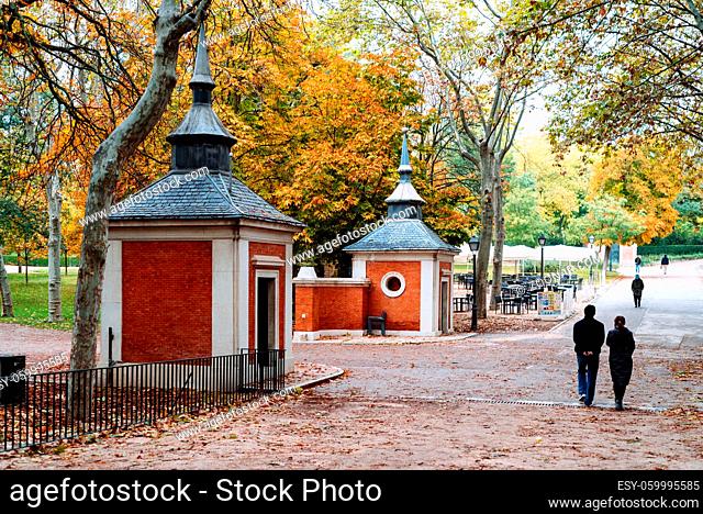 Madrid, Spain - October 24, 2020: Scene of the Buen Retiro Park in Madrid during the fall with vibrant colors and people walking
