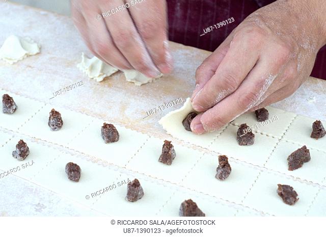 Italy, Lombardy, Crema, Hand Making Tortello Cremasco, Sweet Ravioli Filling the Parmesan Cheese, Amaretti Biscuit, Raisins, Mostaccino Biscuit, Candied Citron