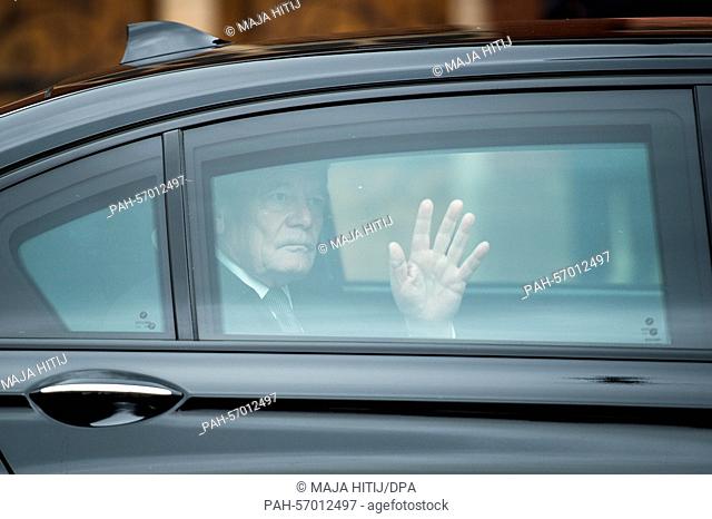 German President Joachim Gauck waves as he sits in a car during his departure following a memorial services for the school students and teachers of the...