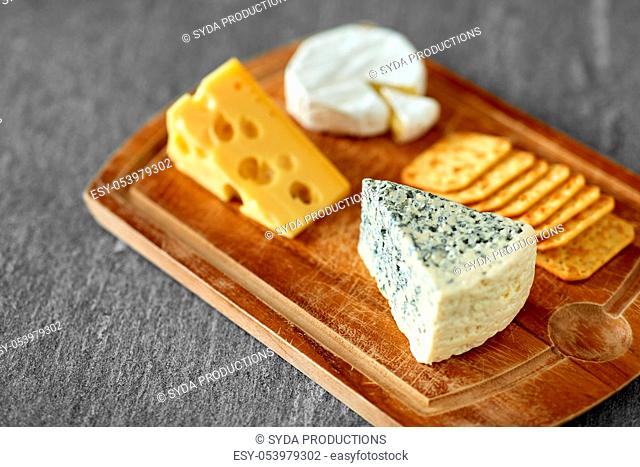 close up of blue cheese on wooden cutting board