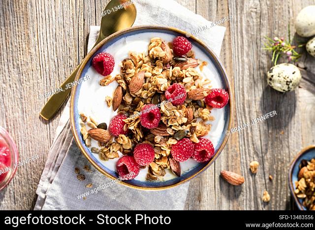 Granola with Greek yogurt, raspberries and almonds