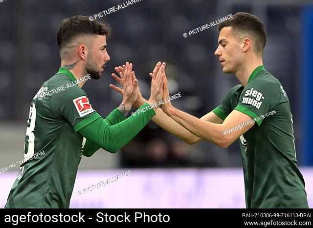 06 March 2021, Berlin: Football: Bundesliga, Hertha BSC - FC Augsburg, Matchday 24 at Olympiastadion. Augsburg midfielder Laszlo Benes (r) is substituted for...