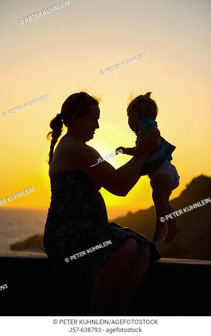 Mother and daughter in the sunset on the island of Kalymnos. Greece