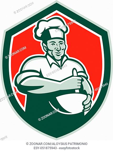 Illustration of a baker chef cook with hat holding a mixing bowl viewed from front set inside shield crest done in retro style on isolated background