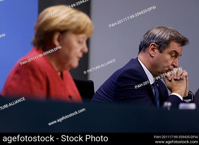 16 November 2020, Berlin: Chancellor Angela Merkel (CDU) and Markus Söder (CSU, r), Prime Minister of Bavaria, explain the results of their previous talks at a...