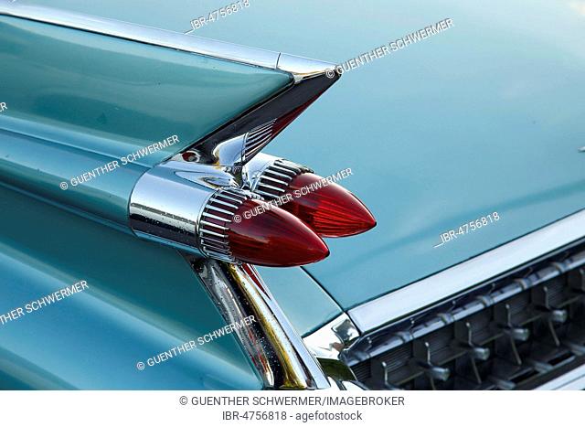 Tail fins with red tail lights of an american vintage car, Cadillac de Ville 1959, Canada