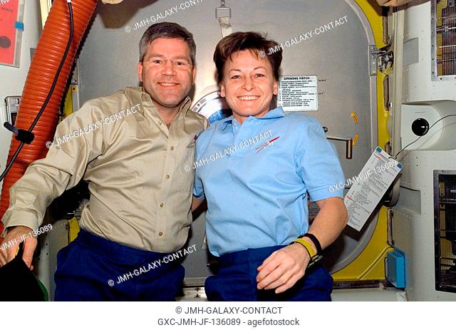 Astronauts Steve Frick, STS-122 commander, and Peggy Whitson, Expedition 16 commander, take a moment for a photo in the Quest Airlock of the International Space...