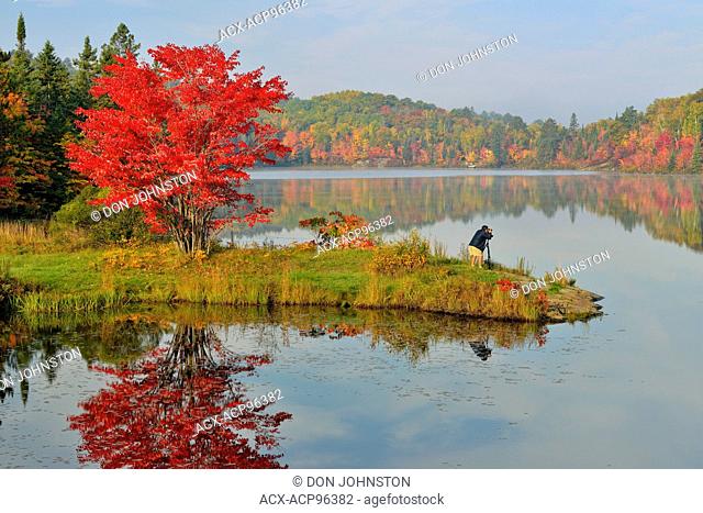 Autumn reflections with phtographer at St. Pothier Lake, Greater Sudbury (Whitefish), Ontario, Canada