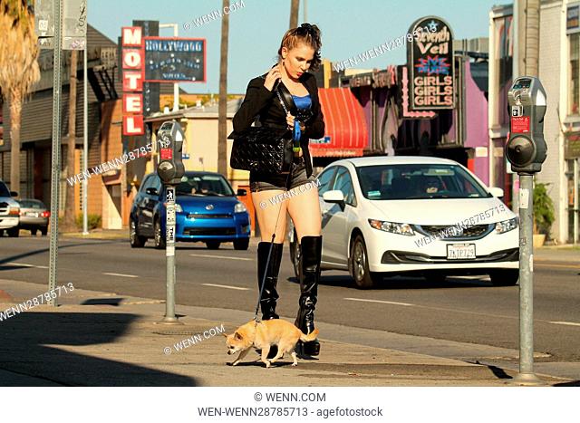 Erika Jordan walking her dog on Sunset Boulevard in Los Angeles, California, where she fixed her make-up using a roll of toilet paper in her purse