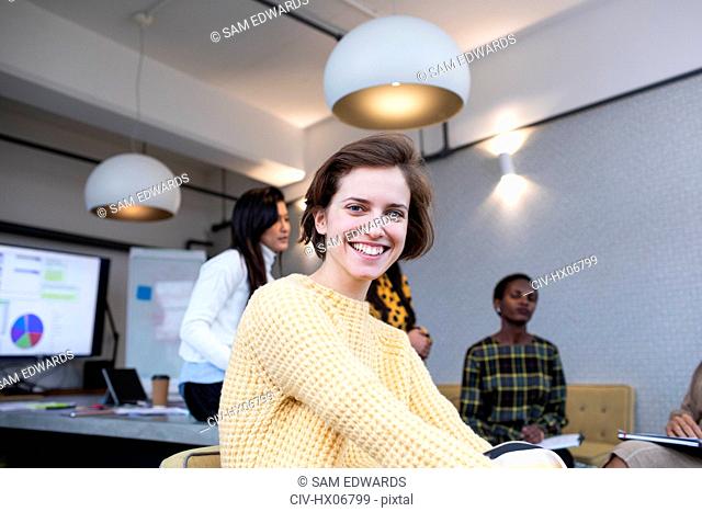 Portrait smiling, confident businesswoman in conference room meeting