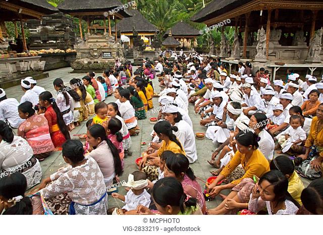 A Hindu crowd worships at the PURA TIRTA EMPUL TEMPLE COMPLEX during the GALUNGAN FESTIVAL - TAMPAKSIRING, BALI, INDONESIA - 08/12/2010