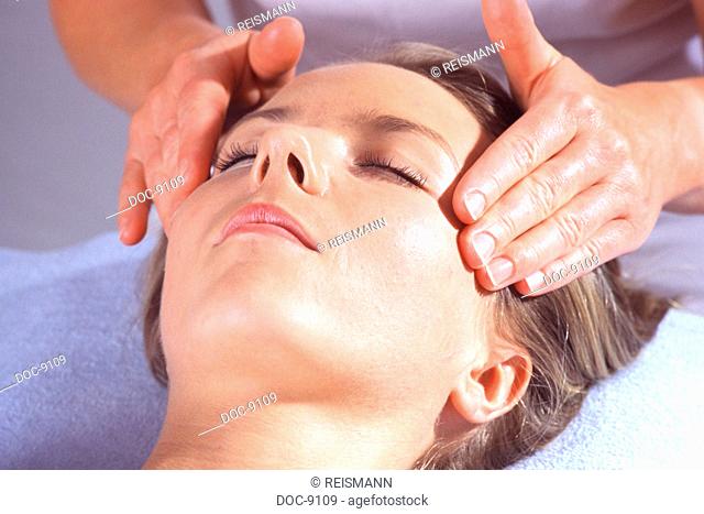 Young adult woman makes herself be spoiled through gentle manual lymphatic drainage