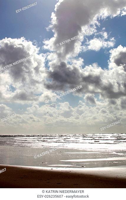 cumulus clouds over the north sea beach