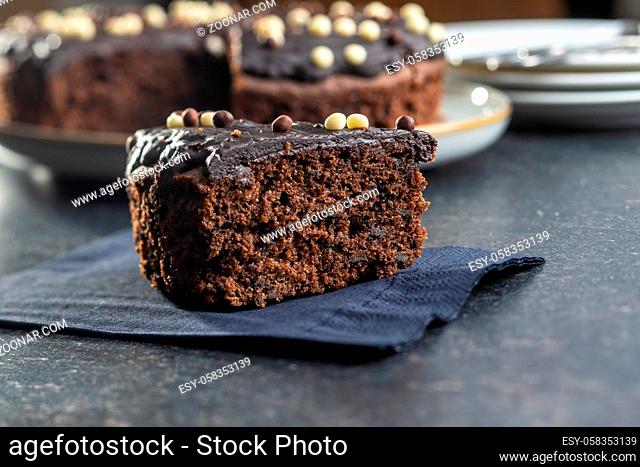 Piece of chocolate cake black table
