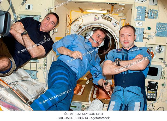 Russian cosmonaut Pavel Vinogradov (center), Expedition 36 commander; along with NASA astronaut Chris Cassidy (left) and Russian cosmonaut Alexander Misurkin
