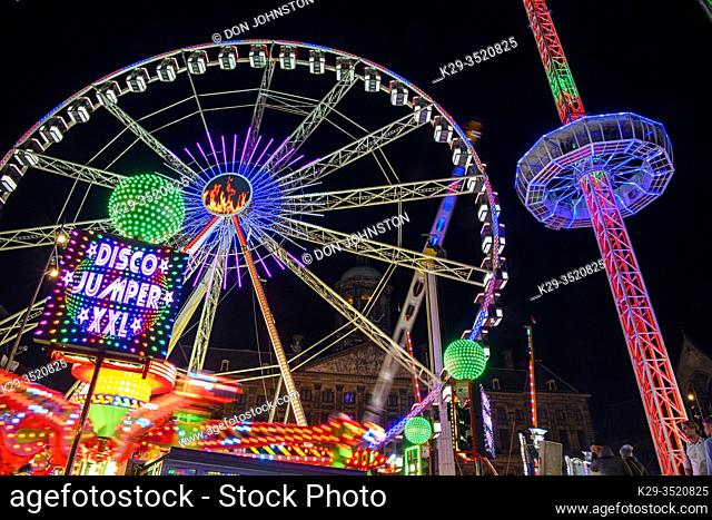 Dam Square Fun Fair Carnival rides at night, Amsterdam, North Holland, Netherlands