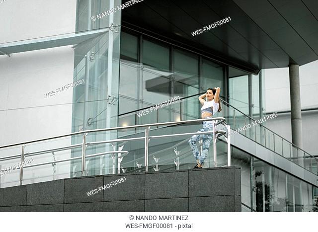 Fit young woman in the city hving a break