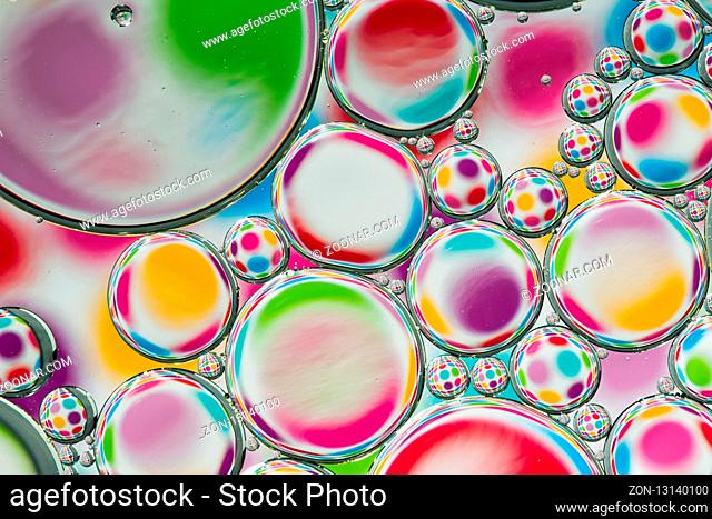 Abstract background of colorful oil drops on water surface